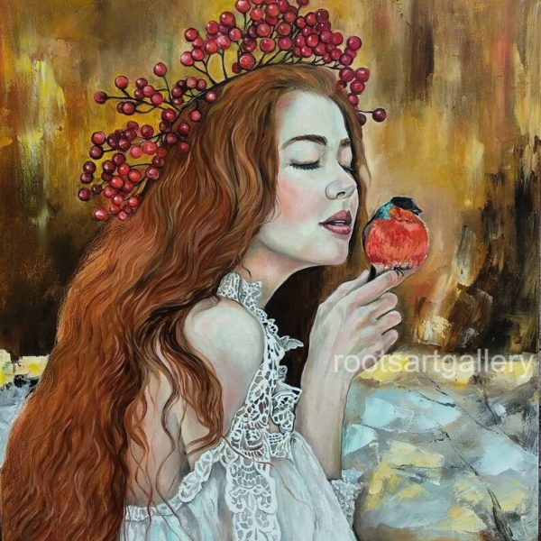 Red-haired girl with bullfinch bird